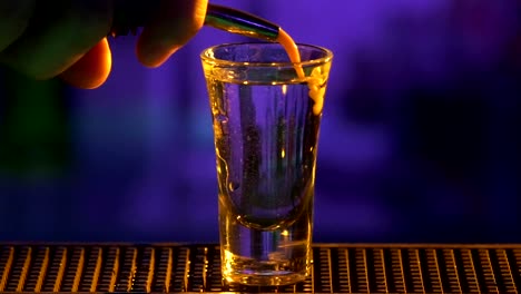 flaming shot cocktail preparation at a bar