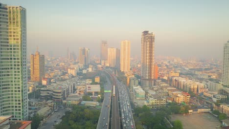 bangkok traffic and buildings at dawn