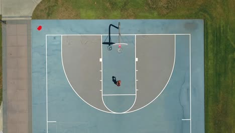 a woman shoots hoops