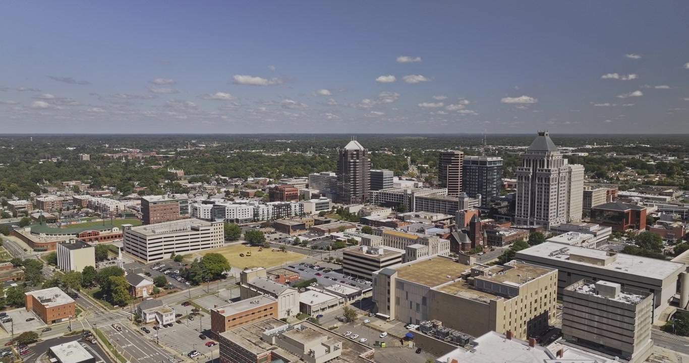 Greensboro North Carolina Aerial v23 orbiting flyover around the downtown skyline, office towers and surrounding streets - Shot with Mavic 3 Pro Cine - Oct 1st 2023
