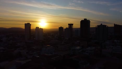 drone-recorded aerial view of buildings at sunset