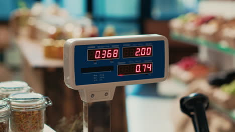 local grocery store weighting scale at empty checkout counter,