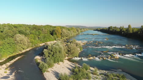 pedestal shot of a little island in the old rhine river, aerial wide shot, germany