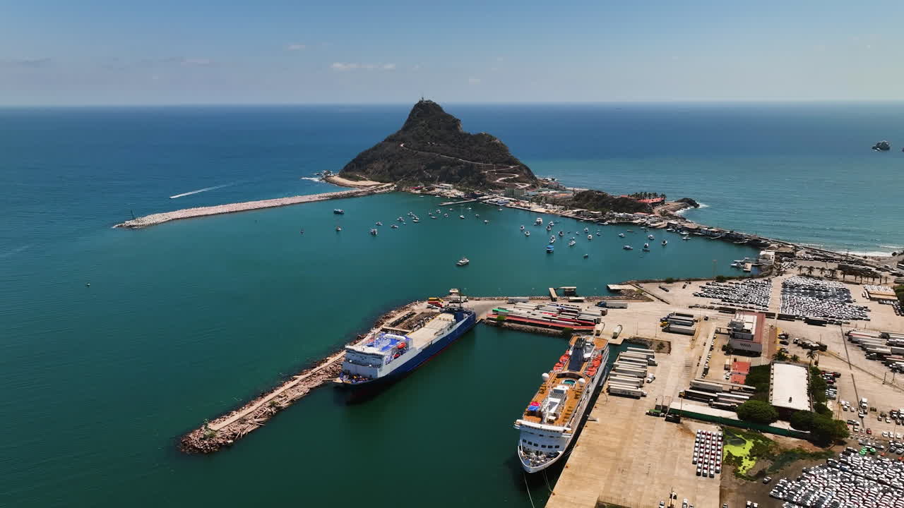 Drone circling cargo and cruise ships at the Port of Mazatlan, in sunny Mexico