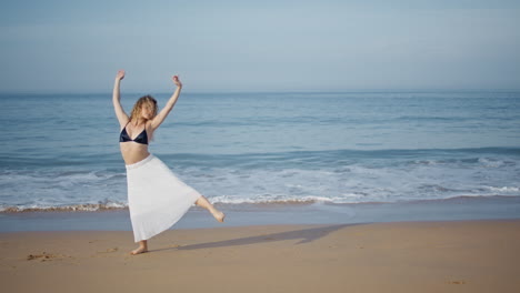 barefoot dancer performing beach summer day. tender woman moving sensually