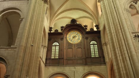 Abbey-of-Saint-Étienne-in-Caen,-France,-showcasing-the-ornate-clock-and-arches