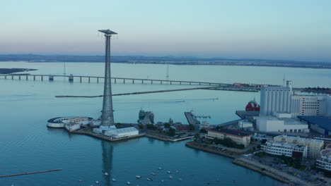 Aerial---Pylon-of-Cadiz,-castle-and-bridge,-Cadiz,-Spain,-wide-shot-lowering