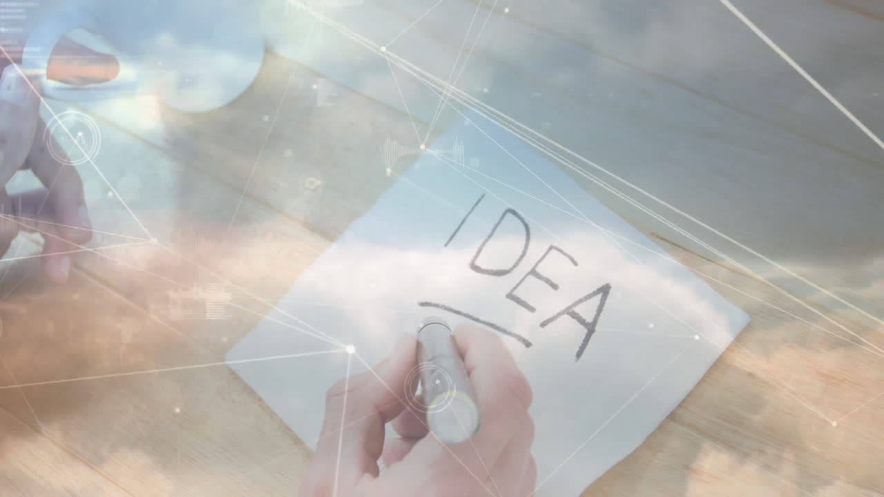 Hand holding metal marker, writing IDEA on paper, overlaying clouds, data charts in flat design