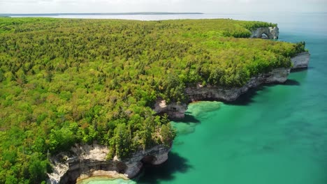 Rock-Cliff-and-Sea-Arch-Lakeshore-Aerial,-Pictured-Rocks-National-Lakeshore