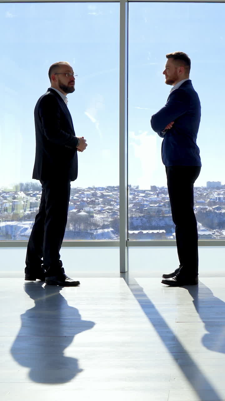 Businessman shadow near the window. Silhoutte of successful businessman