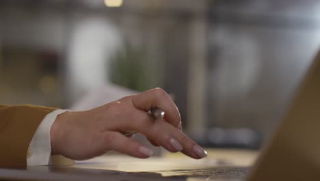 close up of businesswoman in office reviewing and making notes on application or cv for job vacancy 3