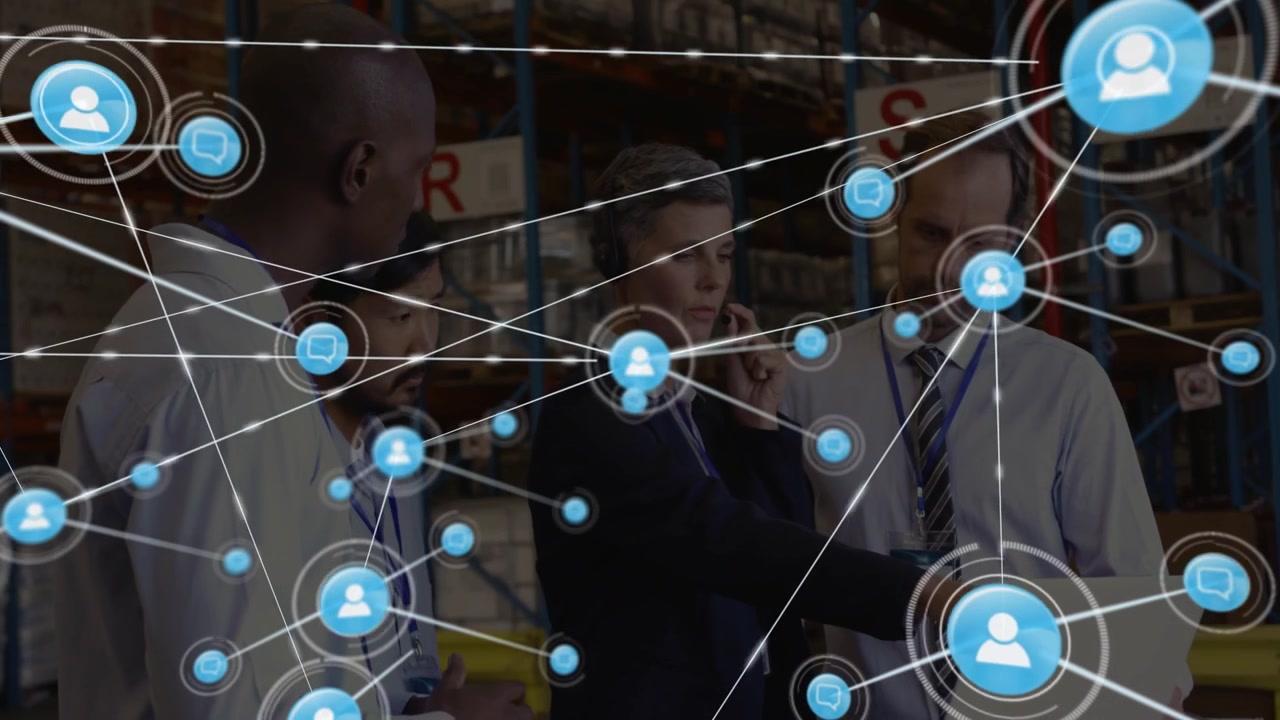 Warehouse team clustering around laptop, initiating node web and expanding logistics map overlay
