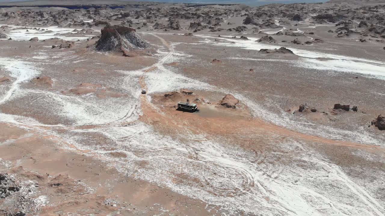 Aerial drone distancing shot of an abandoned bus in Atacama desert, South America, Chile