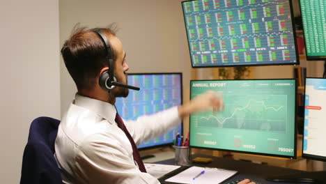 businessman looking at stock market graphs