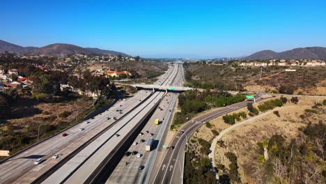 aerial view of a highway winding through mountains