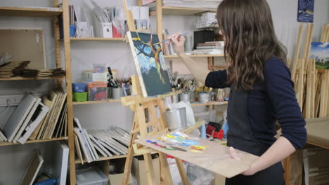 woman painting in an art studio