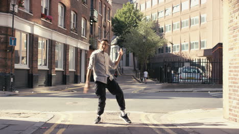 contemporary funky mixed race man street dancer dancing freestyle in the city