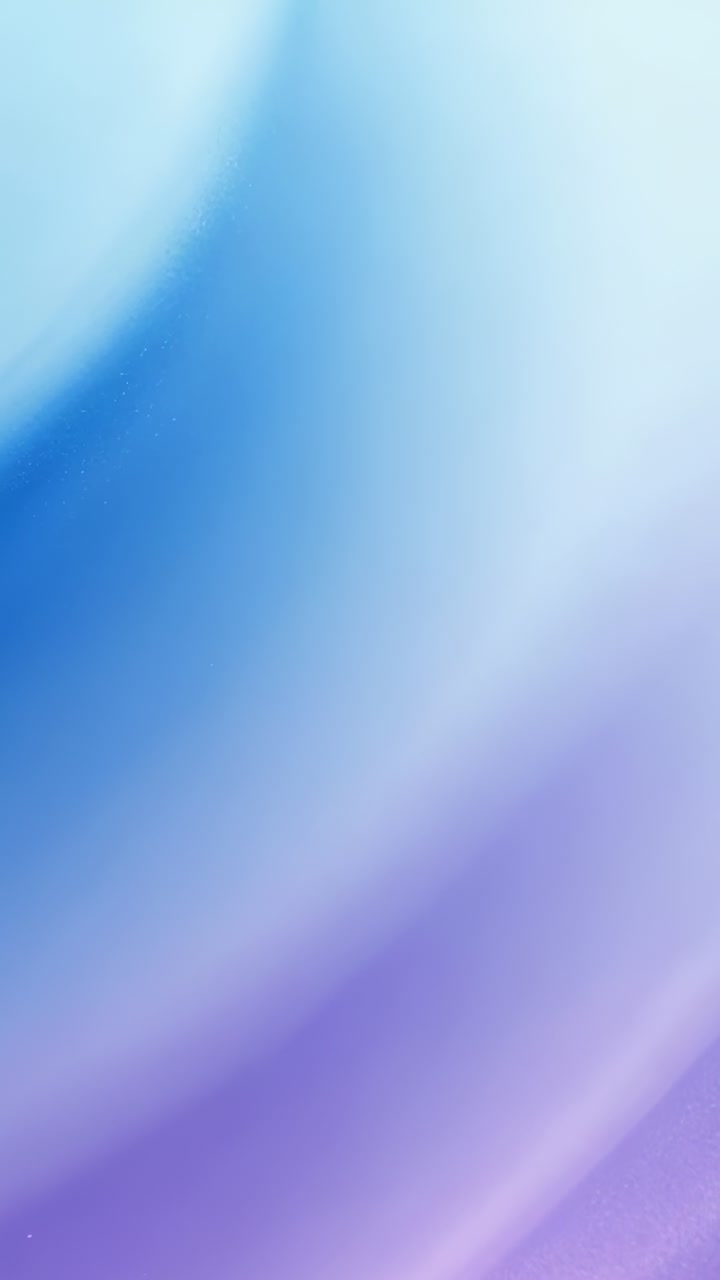 Vertical video: Playback starting, abstract gradient covering frame, blending sky-blue into violet