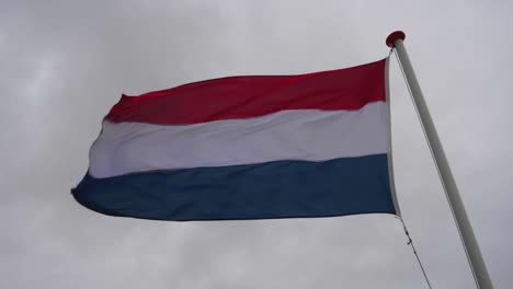 dutch flag flapping in the strong wind - slow motion