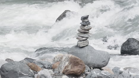 stack of rocks by a mountain stream