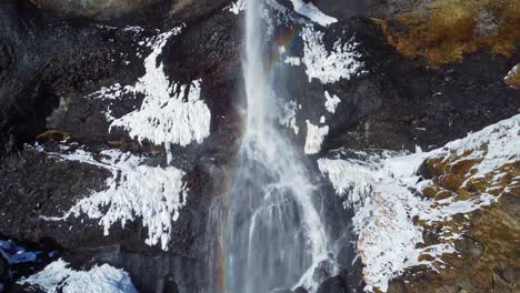 Waterfall-on-snowy-cliff-in-winter