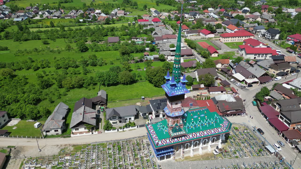 Aerial view of the Merry Cemetery in Sapanta, Romania, a unique cemetery known for its colorful tombstones