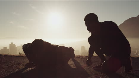 two men exercising outdoors at sunrise