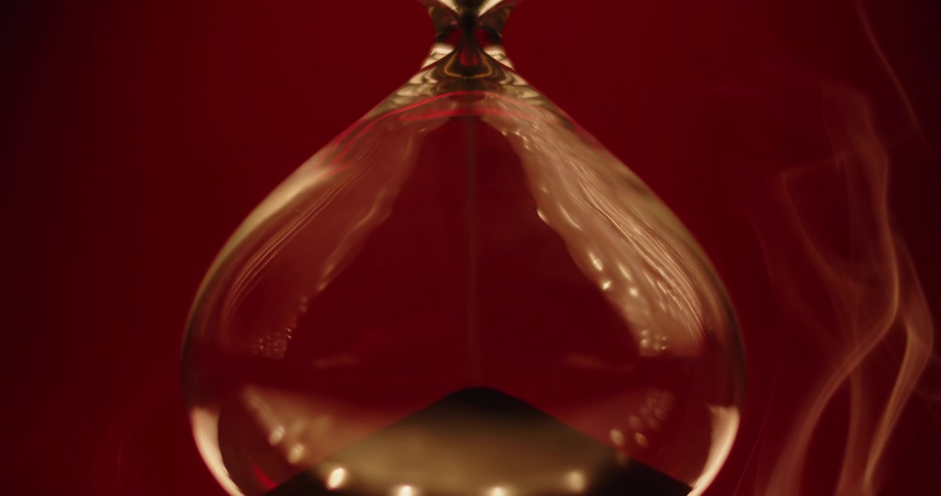 Close up of beautiful smoke on hourglass