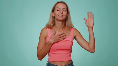 sincere woman raising hand to take oath, promising to be honest and to tell truth swear to be honest