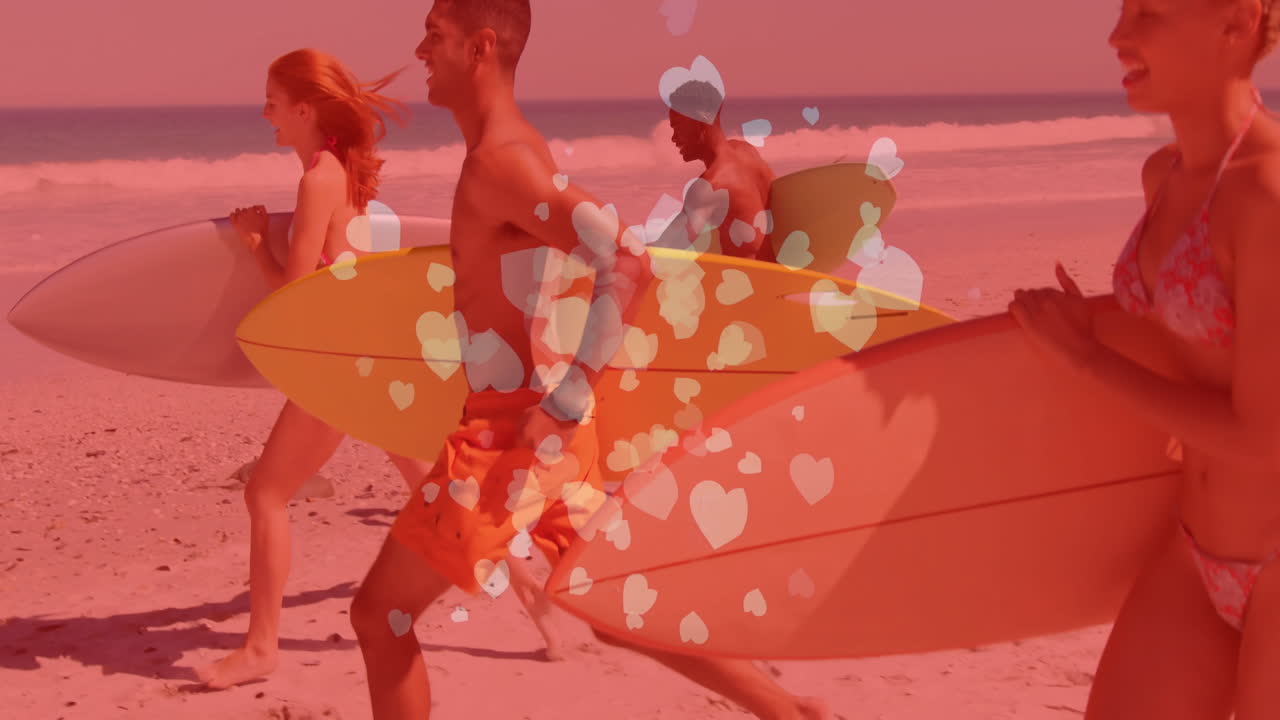 Four friends running along sandy beach to water, carrying surfboards with heart-icon health theme