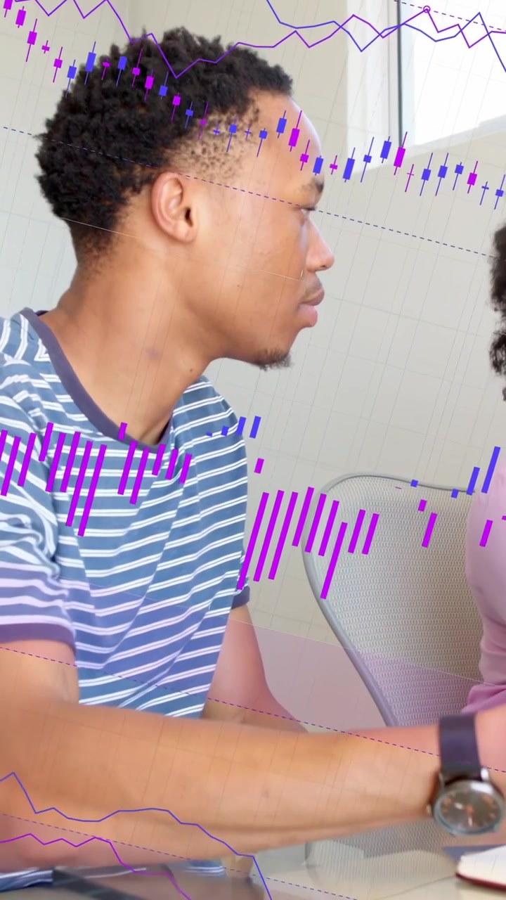 Vertical video: Man leaning, reaching, tapping tablet causing purple chart on glass for finance