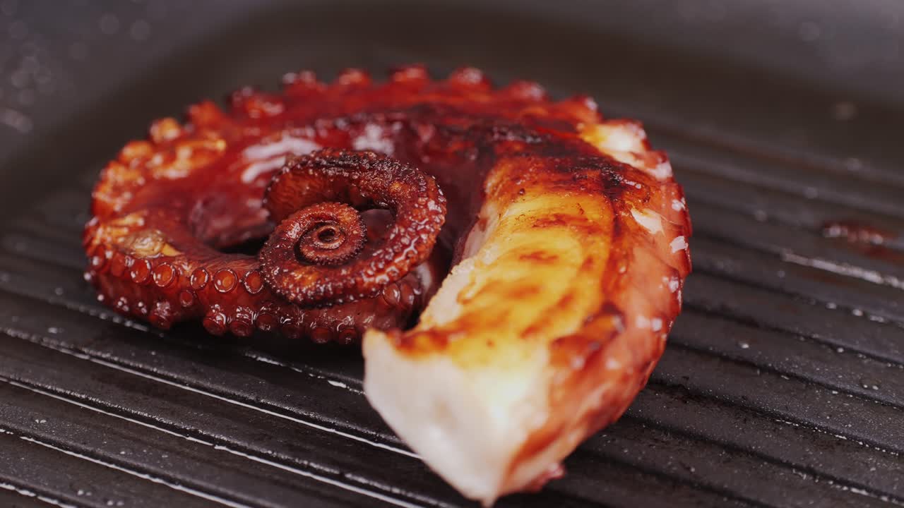 Octopus cooking, chef grill fresh octopus galician style on restaurant kitchen, healthy food, seafood cafe in spain, traditional asian japanese spanish and mediterranean dish.