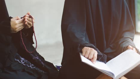 asian muslim women praying and prostrating at home