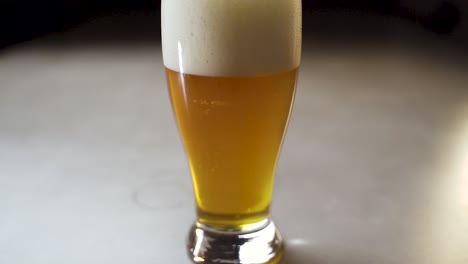 camera slide out to reveal ipa style beer in pint glass