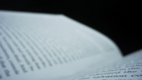 Dolly-shot-white-pages-of-book.-Macro-shot-open-book-with-english-text