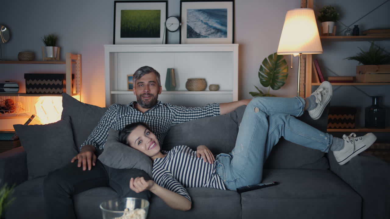 Couple Relaxing and Watching Movie at Home