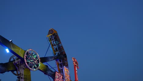 amusement ride spinning at night with lights