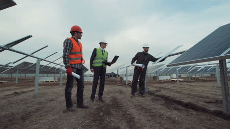 solar panel farm inspection by engineering team