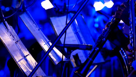 4k close-up of musician playing clarinet in night outdoor concert