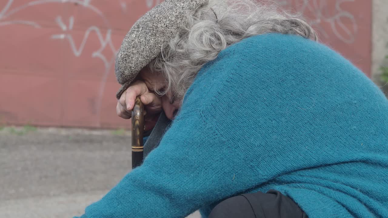suffering stressed woman resting, holding a cane