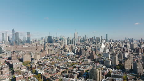 Aerial-panoramic-footage-of-cityscape-with-tall-office-buildings-in-distance.-Downtown-skyline.-Manhattan,-New-York-City,-USA