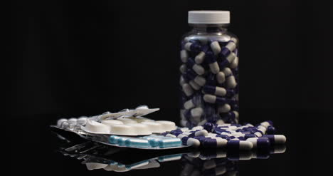 Medicine-Pharmacy-Concept-Extreme-Close-Up-Of-Pills-Blisters-With-Antibiotics-Ampoules-Rotating