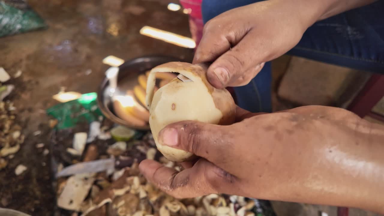 Person Peeling Potatoes