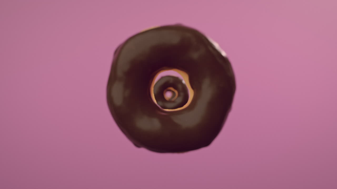 Chocolate glaze donuts on a pink background