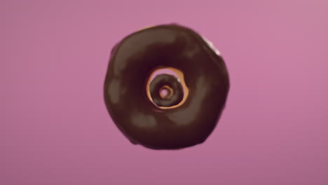 chocolate glaze donuts on a pink background