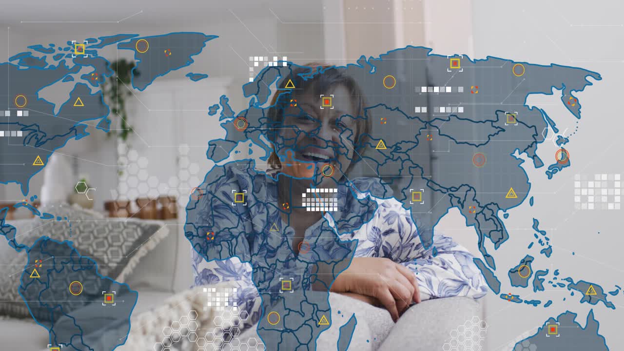 Woman sitting on sofa, laughing as world map fading in overlaying frame showing tech network icons