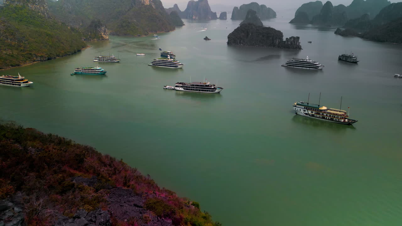 Aerial View Of Ha Long Bay With Limestone Formations And Cruise Boat.