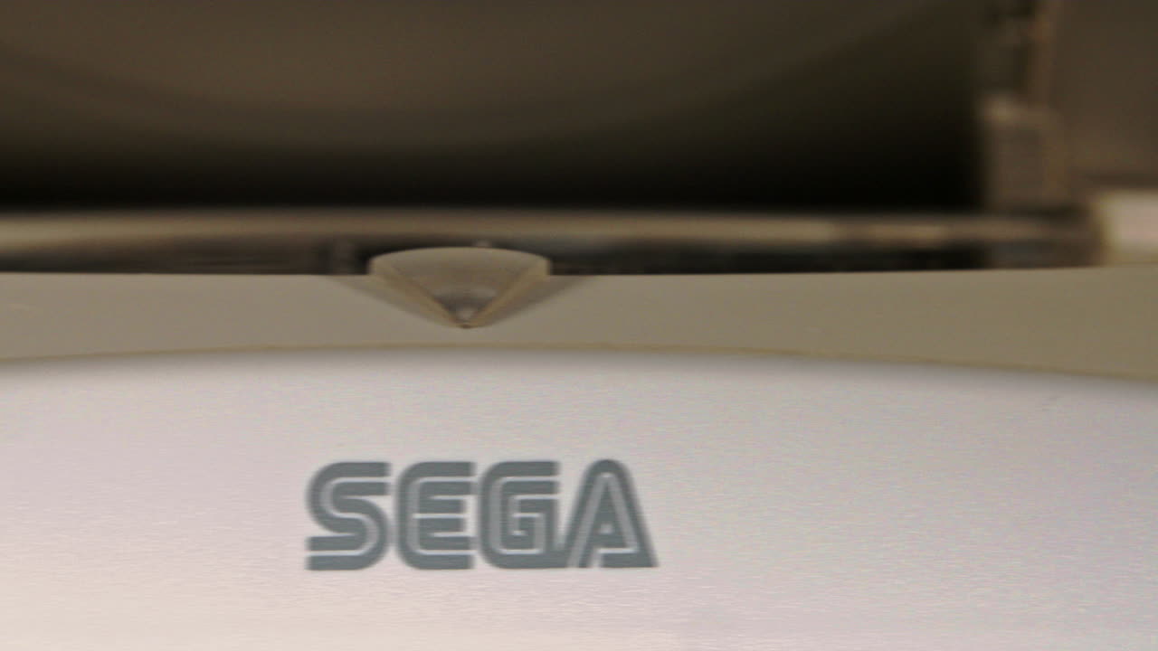 Front of Sega Dreamcast Console and Controller with Lid Closing SLIDE RIGHT