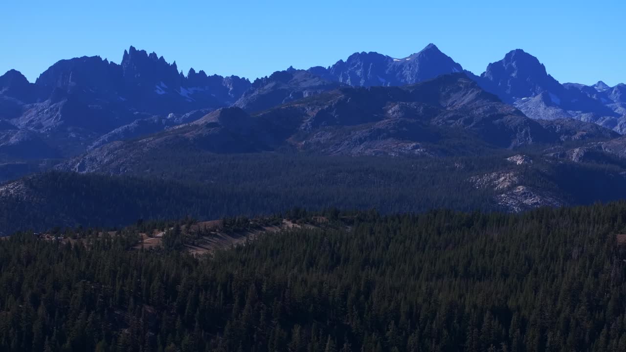 Minarets Vista California Sierras Banner Peak Volcanic Ridge Mammoth Mountain Lakes Yosemite NP aerial drone PCT Trail afternoon morning blue sky clouds nature landscape backwards motion
