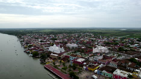 rotational-drone-shot-of-the-main-church-and-the-papaloapan-river-in-tlacotalpan,-veracruz,-mexico